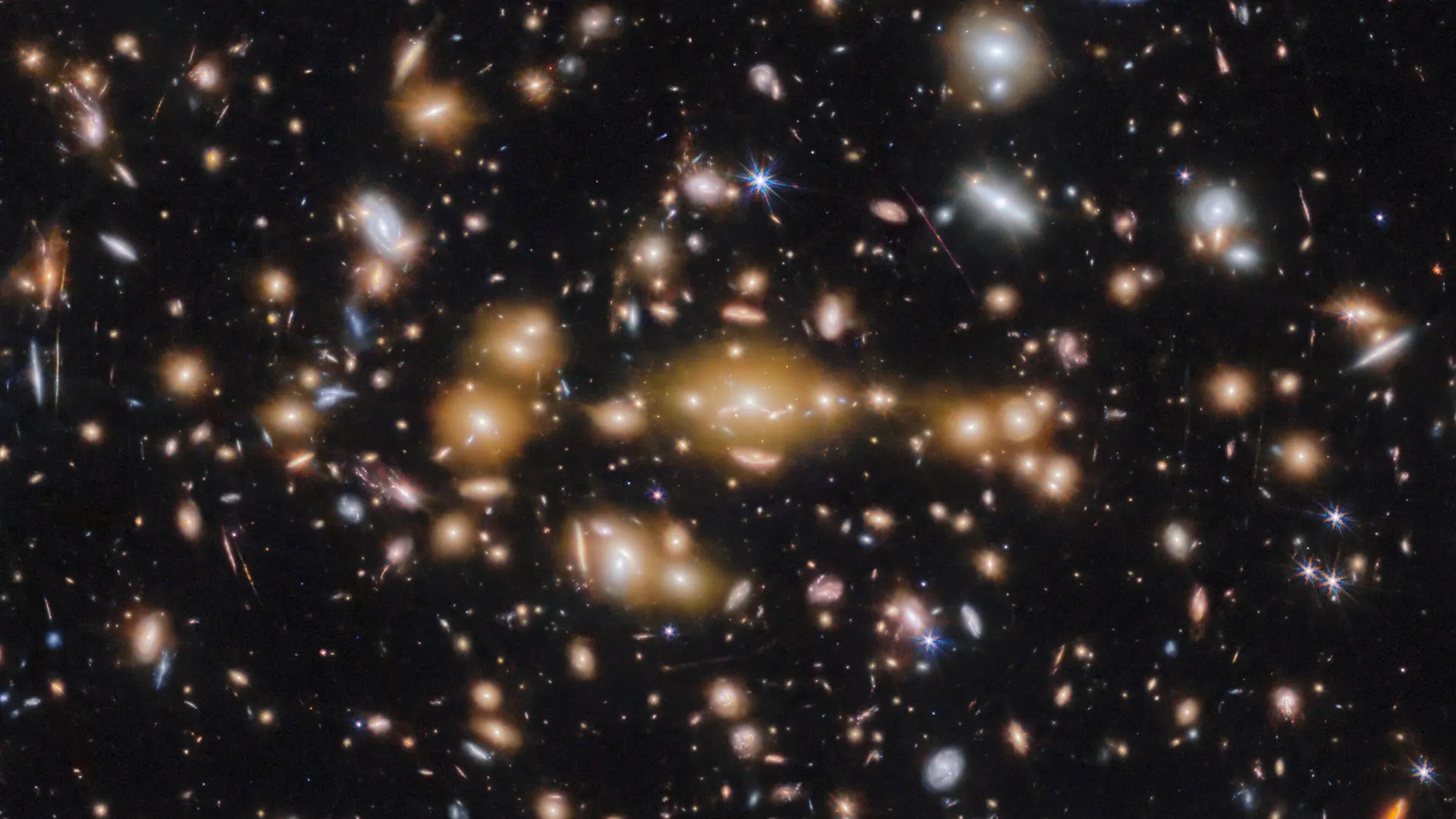 A field of many galaxies pictured by the James Webb Space Telescope. Images courtesy of ESA/Webb, NASA & CSA, L. Bradley (STScI), A. Adamo (Stockholm University) and the Cosmic Spring collaboration
