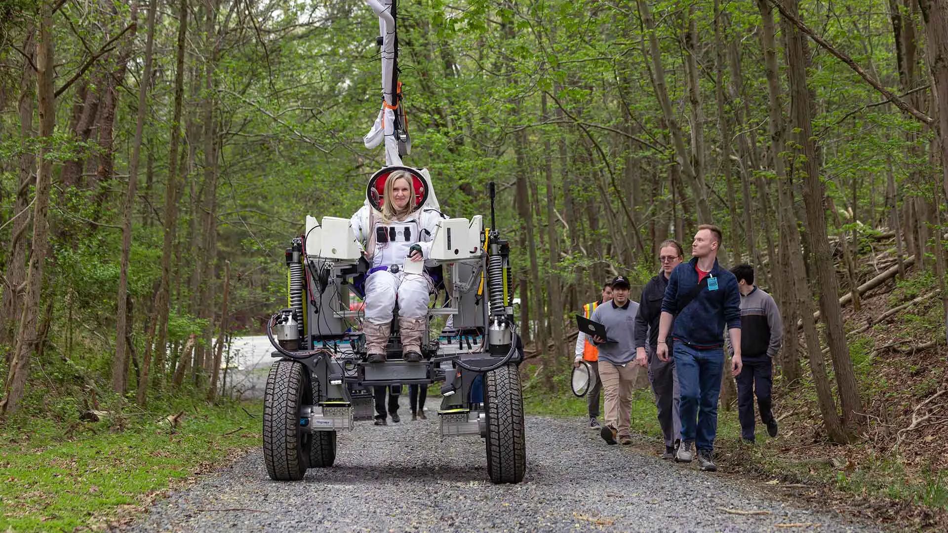 UMD student researchers look on nervously as the author takes their rover for a run-through at NASA Goddard Space Flight Center