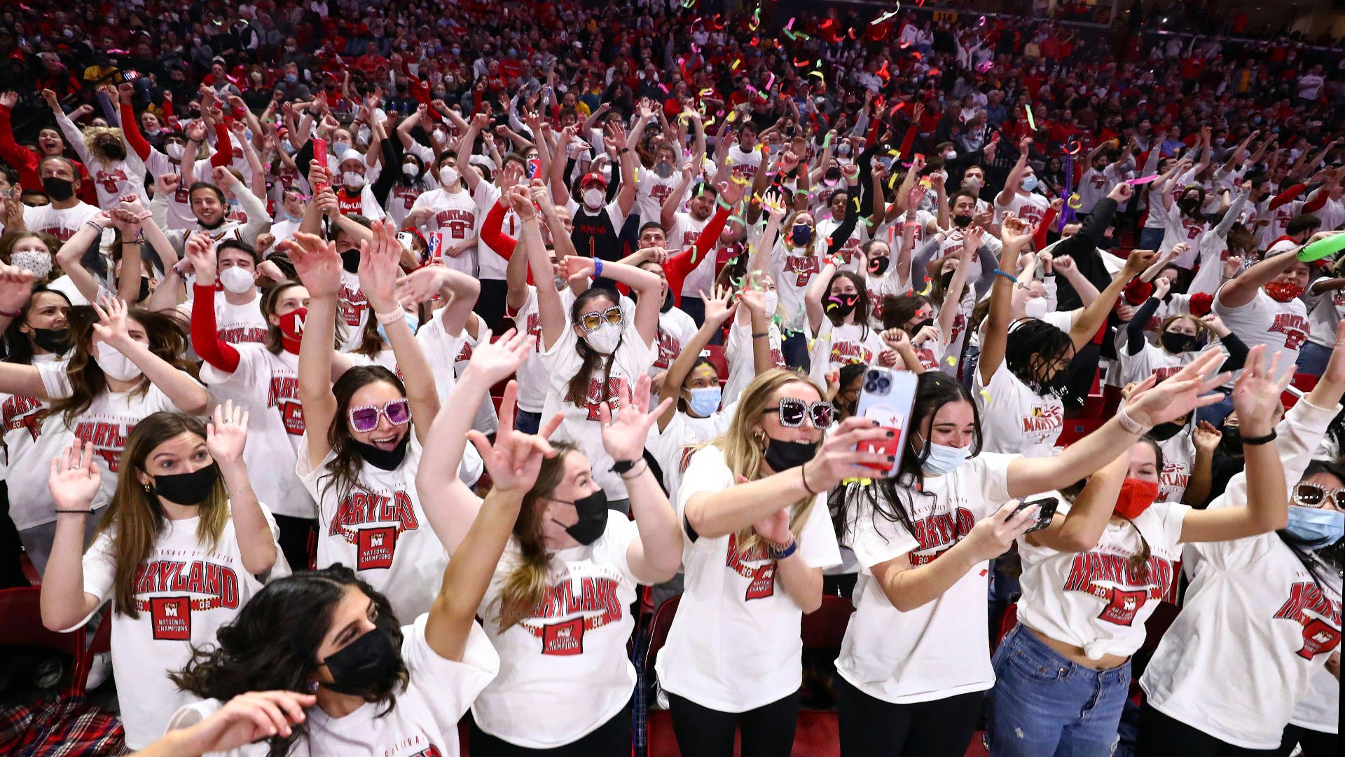 Students pump up the crowd during the 2022 flash mob at the Terp men's basketball game against Ohio State. The annual tradition, choreographed by Megan Piluk '13 and Jen Miller, began in 2013. Photos courtesy of Maryland Athletics.