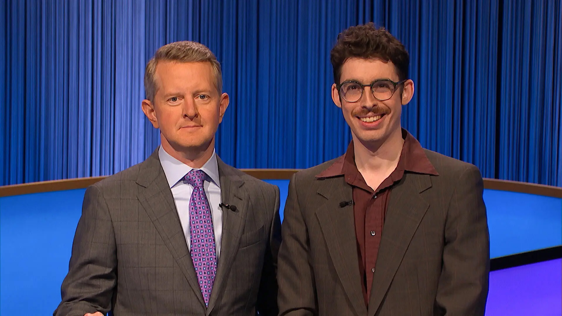 Isaac Hirsch '14, right, with "Jeopardy!" host Ken Jennings during his winning streak. The UMD history grad credits, in part, his UMD Quiz Bowl and standup experiences with his successful run—and is looking forward to coming back during the next Tournament of Champions.