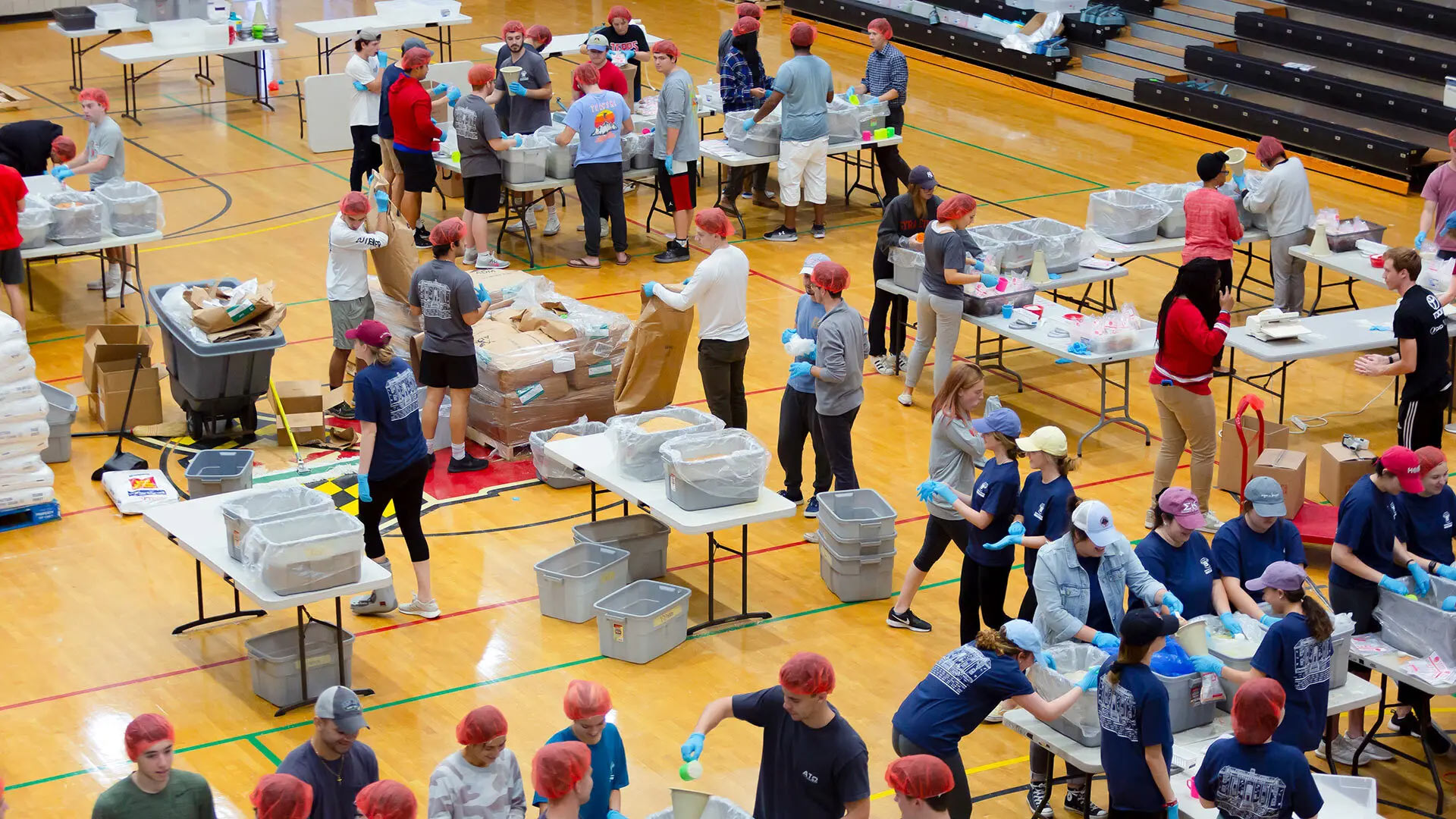 Students package thousands of nonperishable meals for Terps Against Hunger at Ritchie Coliseum in 2019. The organization has donated more than 3 million meals to the Capital Area Food Bank through dozens of volunteer-driven events on campus over the last 10 years. Photo by Emma Howells.